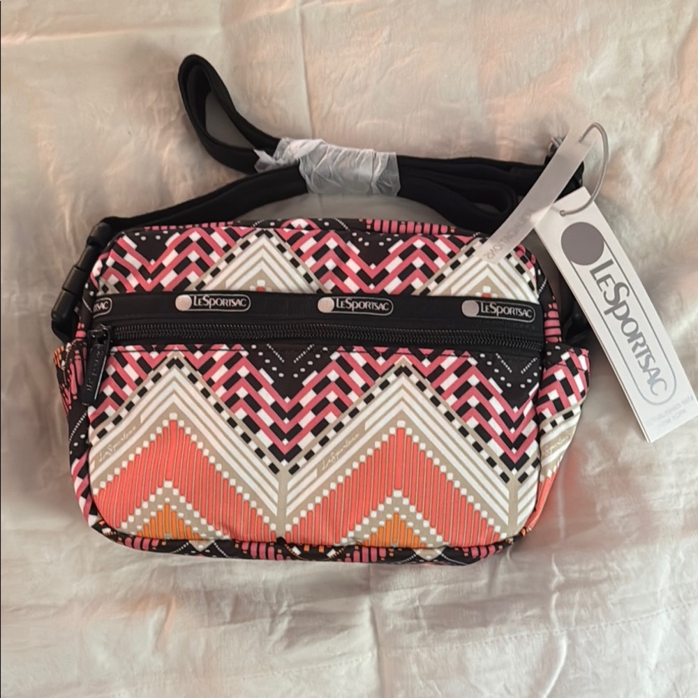 LeSportsac Pink and Black Crossbody Bag with Geometric Design